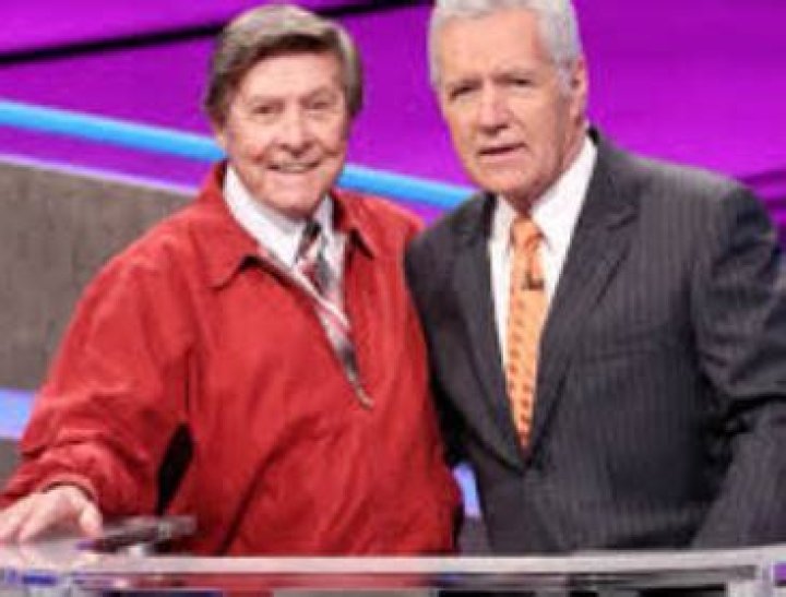 Johnny Gilbert, a show business personality is the announcer of Jeopardy who works alongside Alex Tr