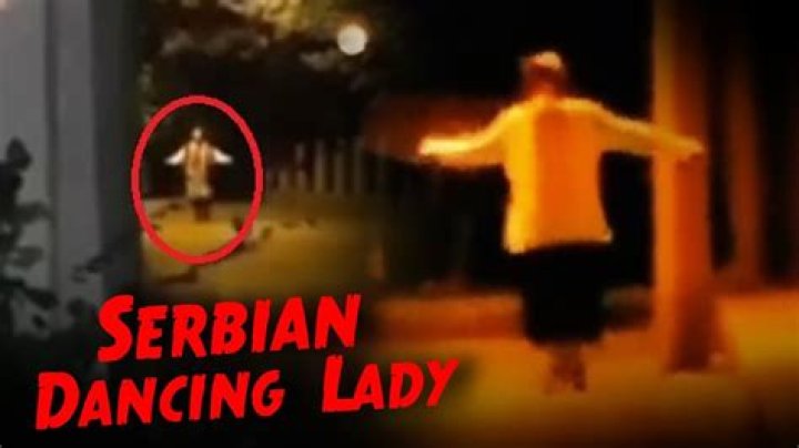 Enchanting Dance Moves: Lady Gracefully Twirls In The Street