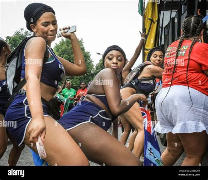 Women twerk to reggae, have water thrown at them over coffin at funeral ·